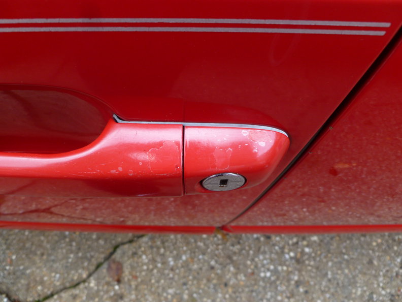 Clearcoat is delaminating on driver handles. Can be polished. Layer underneath is shiny.