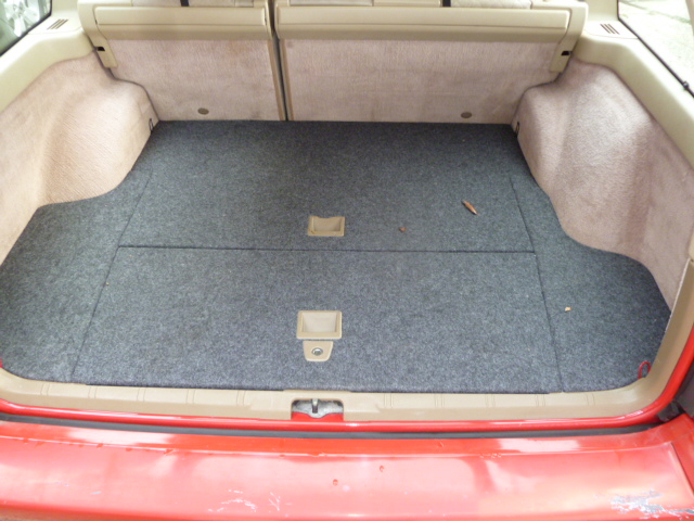 Cargo area was a mess when I got it. It's been reupholstered. I went with gray because it doesn't show dirt, and I couldn't find the proper tan.