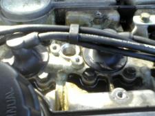 under my spark plug cover