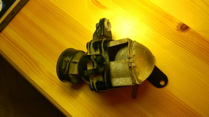 The assembly out of the housing (you may notice that the assembly is different, but the other one is just like yours)