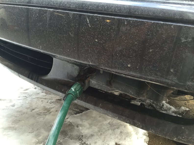 Cord mounted behind grill, plugged in. Grill removed for the winter.