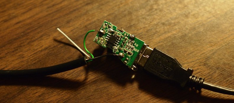 Circuit board from inside USB car charger. Green is +12V, black is ground.