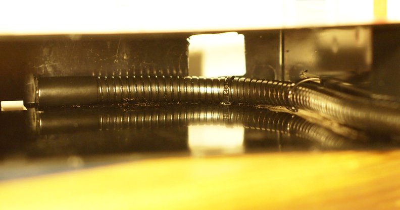 All zipped in. Get 'em tight - you don't want this thing rattling. I did add one more at the end of the gooseneck after taking this photo, which made it more resistant to rotation and made adjusting the phone's position easier.