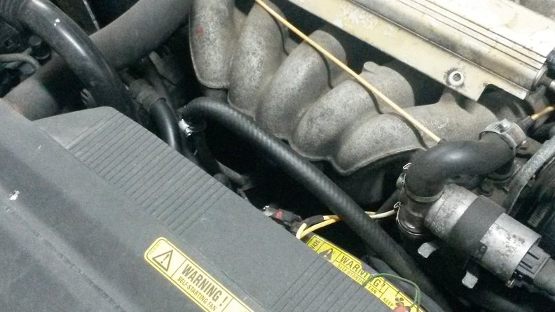 Heater hose attached to dipstick