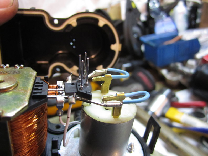 Connector pins and matching holes in cover