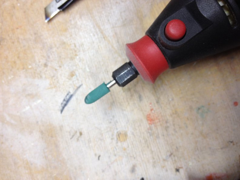 rotary tip used for removing polymer material from cover