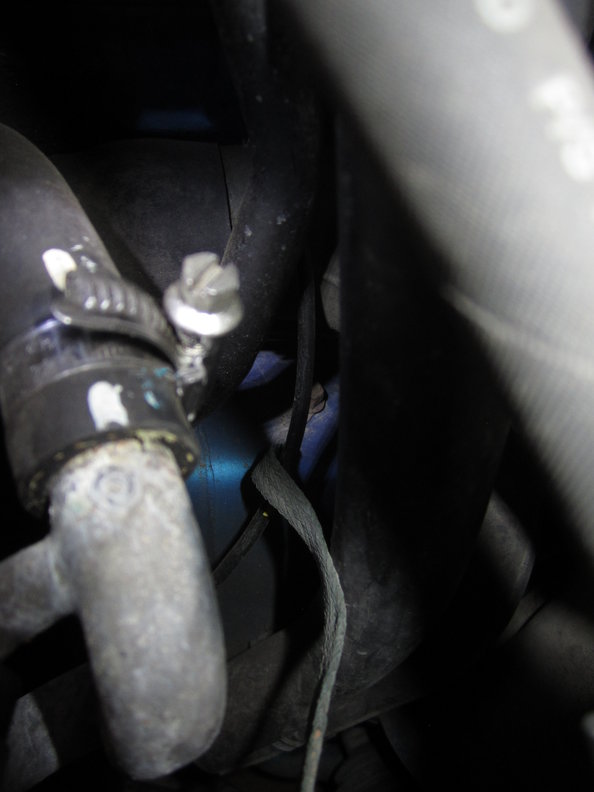 Cam cover earth strap mount on chassis rail.