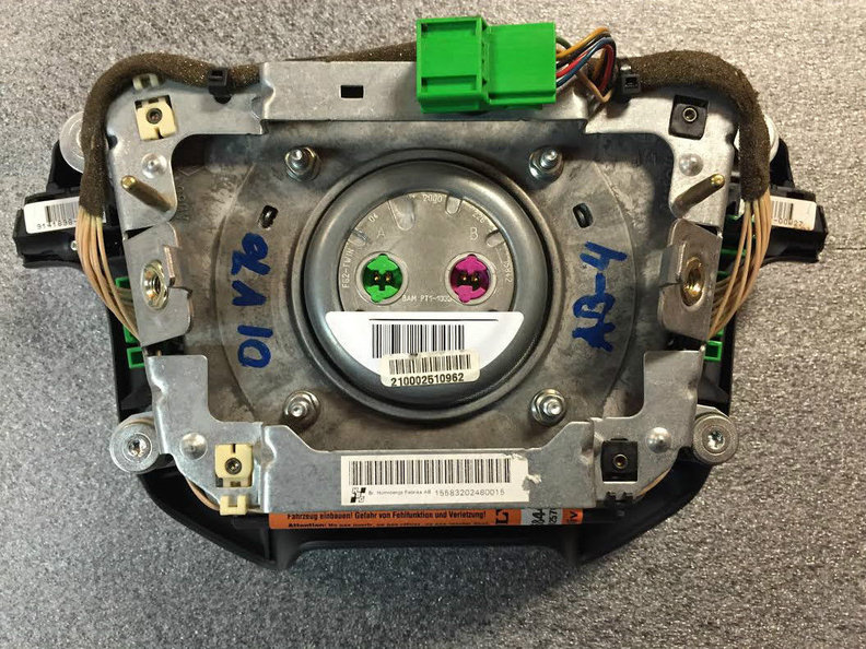 one green and one magenta pinout on back of air bag.