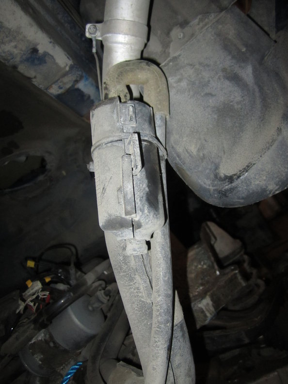 Lower down about 10" from top with plastic canister