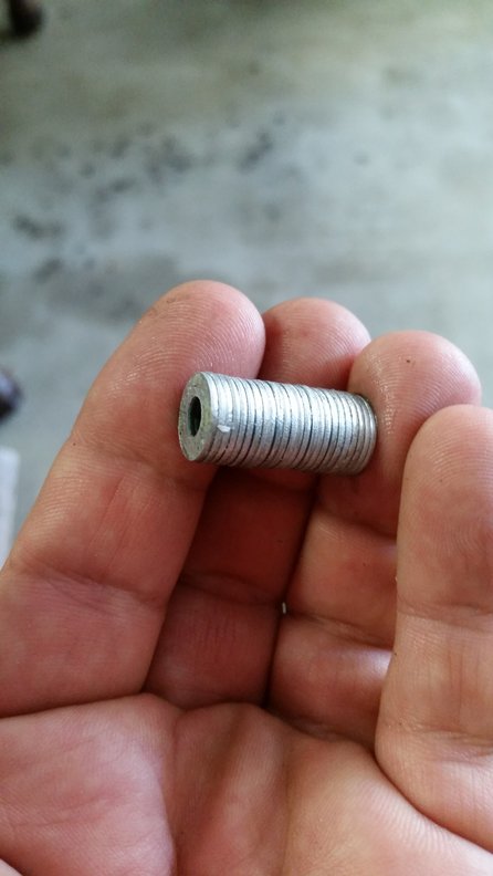 Home made bushing. Glued #8 steel flat washers.