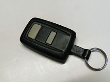 Two button key fob with buttons one above the other.