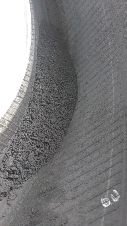 For the sake of trivia.. remains of the tire ground off inside