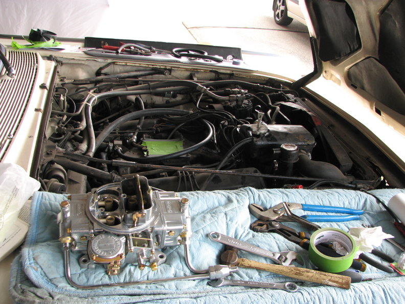 Prepping the carb, removing junk from the manifold.