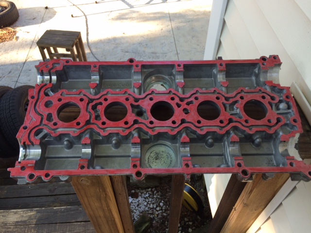 Cam cover with gasket material