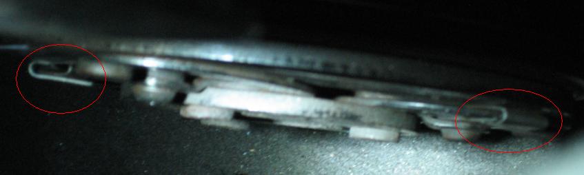 View from above with two metal shims wrapped around the plate springs