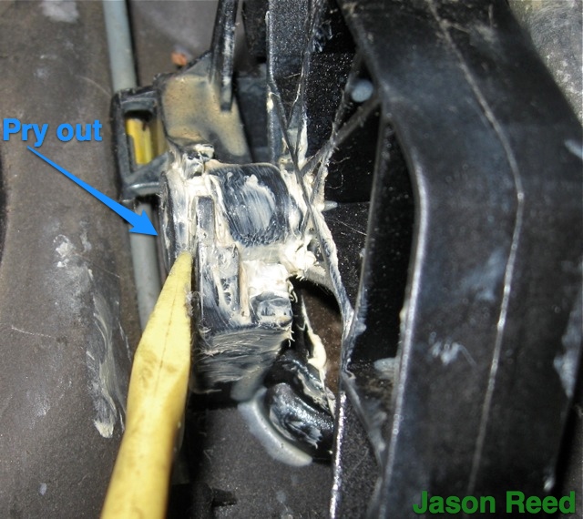 Prying out the pin that holds the pedal in place