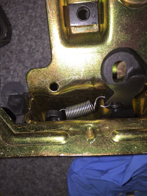 step 9 - new spring installed inside the latch. Click the levers back and forth it will be obvious how it works.