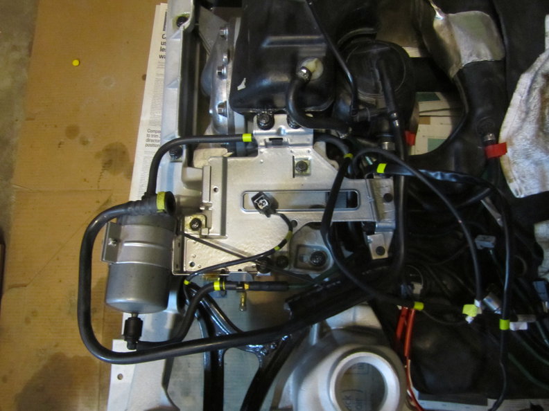 Carbon canister mounting plate back in