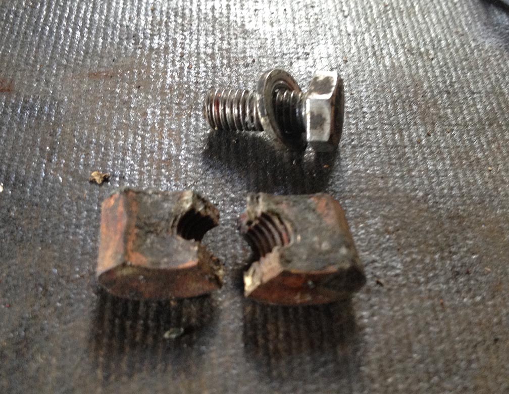 The bottom part which broke. It has a special shape to create the pressure on the terminal post.