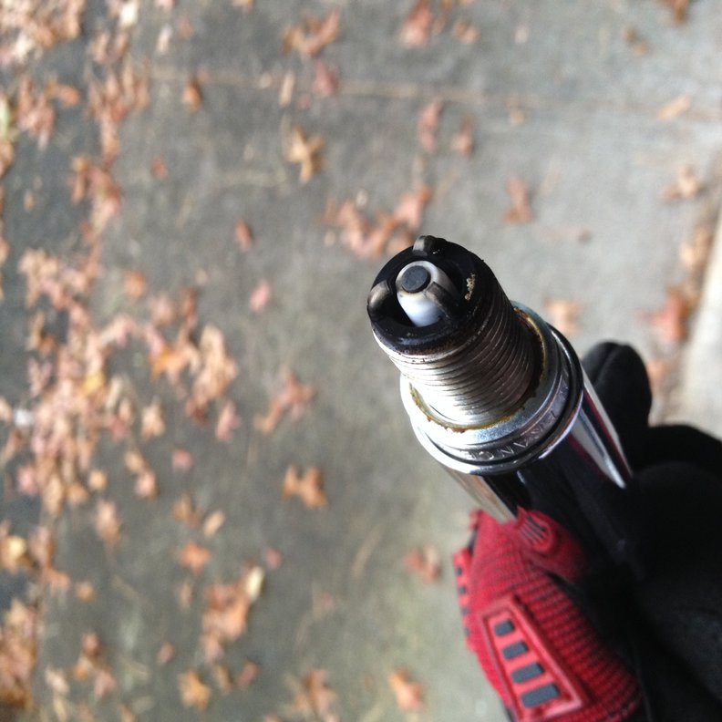 Spark plug No. 3 with some white-ish ashy residue