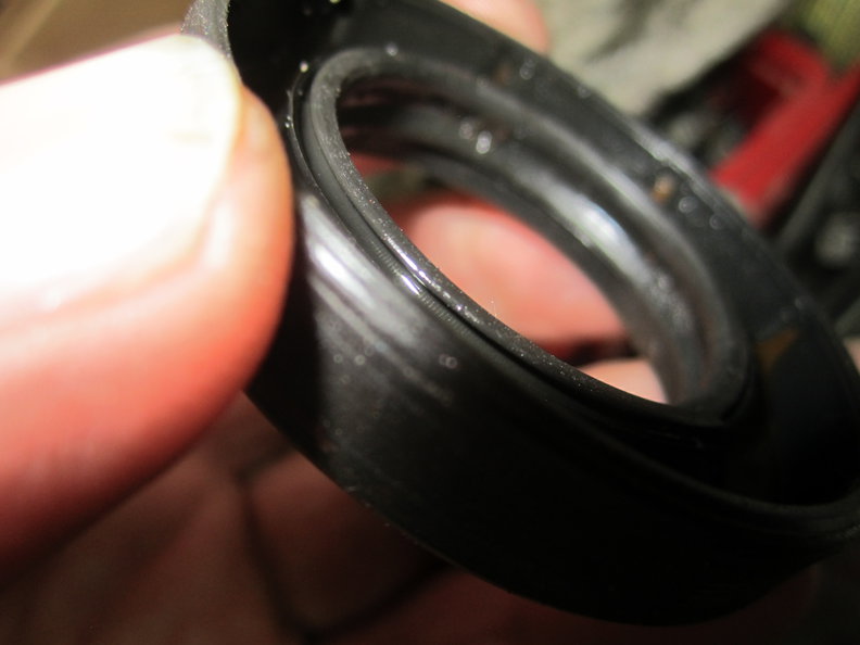 Inner seal side with pocket for coil spring