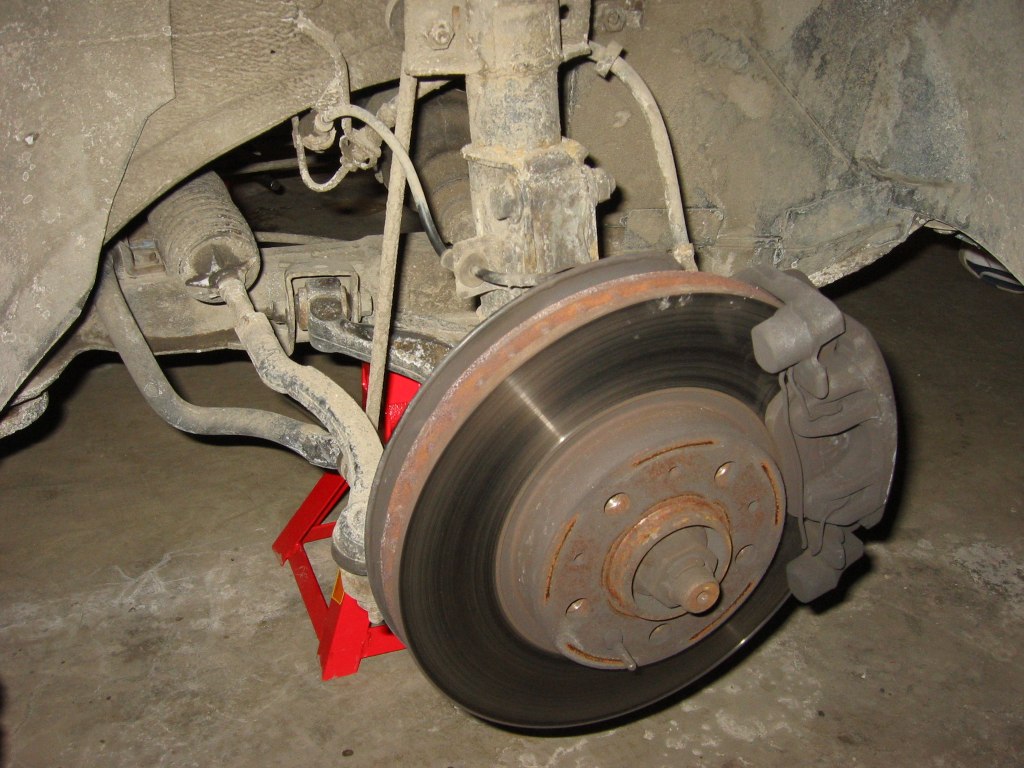 So, you want to change your struts but don't want to pay expensive labor?  You've come to the right place!  Why throw away your hard earned money when you can do it yourself!<br /><br />    This vehicle in the guide is a Volvo 850, but any cars with MacPherson Struts will have similar setups.<br /><br /> <br /><br />Equipments you need:<br /><br />Socket set - It depends on your car, if you can get your hands on a set for both SAE and metric that would be great!<br />Socket wrench<br />Torque Wrench - you need one to properly torque the nuts back to specs.  Borrow one or buy one on ebay, I got one for $30 USD, not expensive considering all the things you can do with it.<br />Pipe Wrench or Volvo strut nut tool - to grab hold of the struts and take off the cross shaped strut retaining nut.<br />WD-40/Liquid Wrench - Some of the bolts will be on very tight or rusted.<br />Floor Jack and 2 Jack Stands - Never work on the car not supported by jack stands, you're just looking for trouble if you do!<br />Quality Strut Spring Compressors - Very Important!  The springs contain enough energy to kill you.  You can usually rent them at you local auto stores for a few days.  With good strong compressors this job is not as dangerous as it seems.<br />Repair manual - get a manual for you car, Haynes is a good source for quality manuals.<br />New strut mounts (2, Volvo part # 3546189)<br />Updated: The strut mounts I bought off FCP Groton failed in another 50000kms.  However, I do push the car into corners much faster than most of the sane Volvo drivers would do, so your mileage will probably be slightly better.<br /><br />spring seats (2, 8646713)<br />strut-to-steering knuckle nuts and bolts (4 ea. Nuts # 948645 Bolts # 965194 )<br />suspension strut upper mounting nuts (6, 971099)<br /><br />Updated: According to FCP Groton the part numbers are as follows:<br />948645 Strut Mount Lock Nut (6 req) $1.25 OEM Picture<br />965194 Bolts (4 req) $1.50 Genuine Volvo Picture<br />971099 Lock Nut for above bolt (4 req) $2.00<br /><br />6 hours - if its your first time, it will take that long (or even longer, if the bolts are rusted)<br /><br />Buy your parts at fcpgroton.com usually have the cheapest prices for Volvo parts.