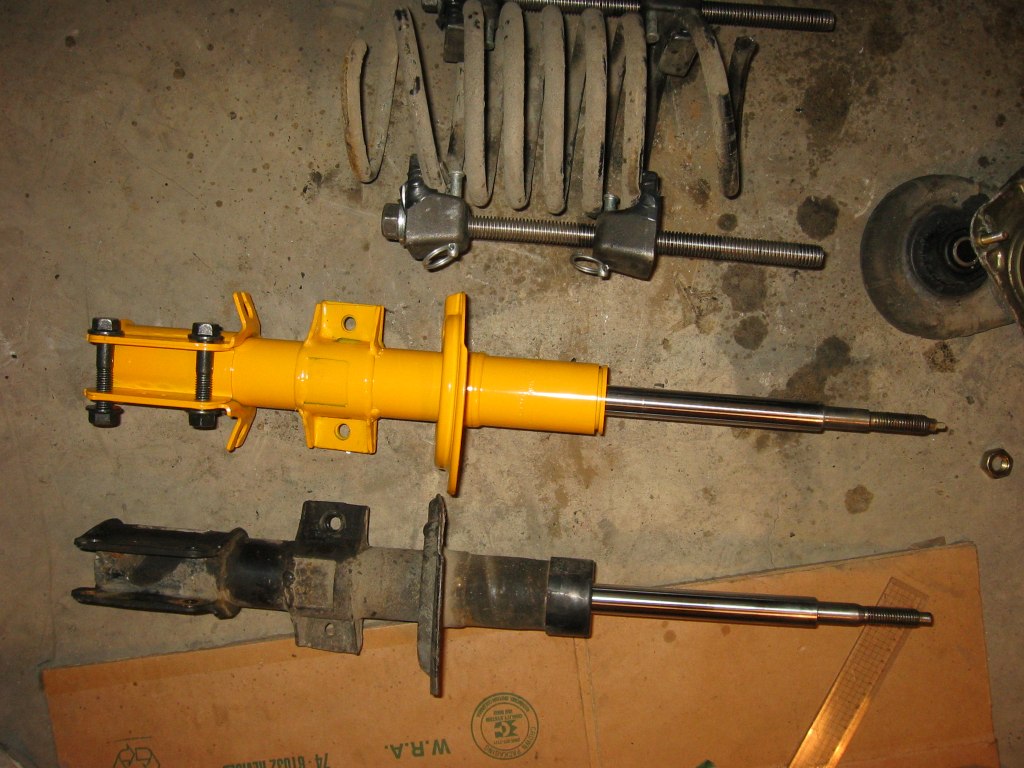 Mark the spring so you won't put them back in upside down. <br /><br />Once you can wiggle the spring, it is now safe to undo the strut retaining nut, take out the special washer, undo the cross shaped retaining nut with a pipe wrench, and take out the strut bearing mount and spring seat. <br /><br />The manual said inspect for damage and replace as needed.  But I say, if your car have more than 60000 miles, just replace them, they're gonna die soon anyway.  Also the dust boot and cap might be cracked, replace those if you need to.  Mine are fine, so I just reused them.