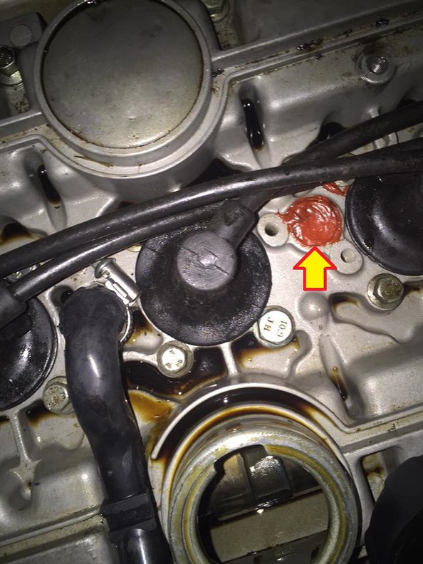 arrow points to said plug. head bolts are not my doing.