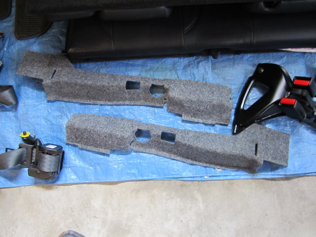 Spare wheel side carpet and seat belts
