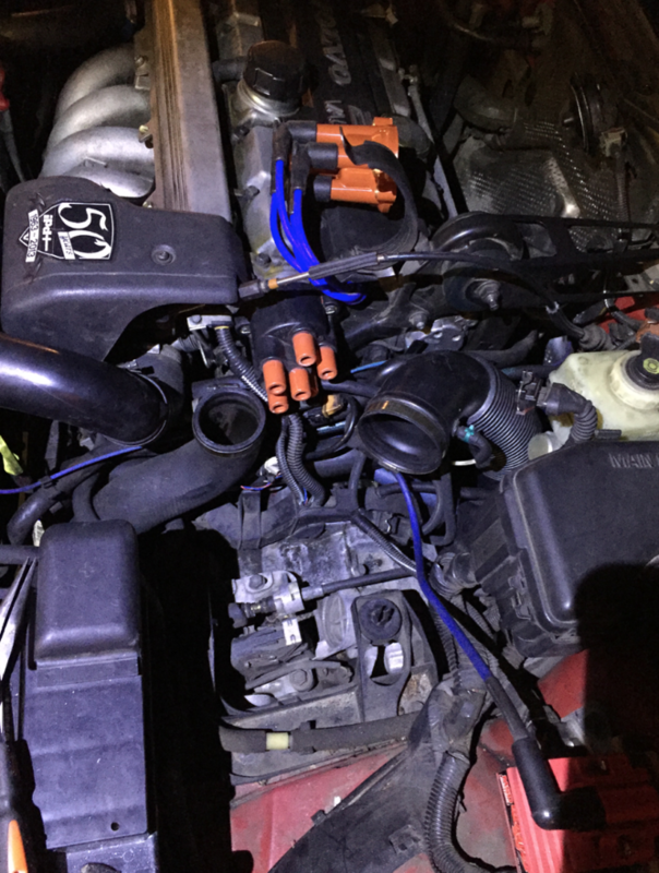 Transferring the wires from old to new cap. This is right before I remove the old cap.