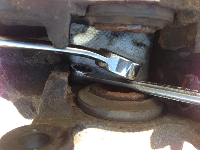 Pushing piston back in, not! Mine are seized and new calipers needed