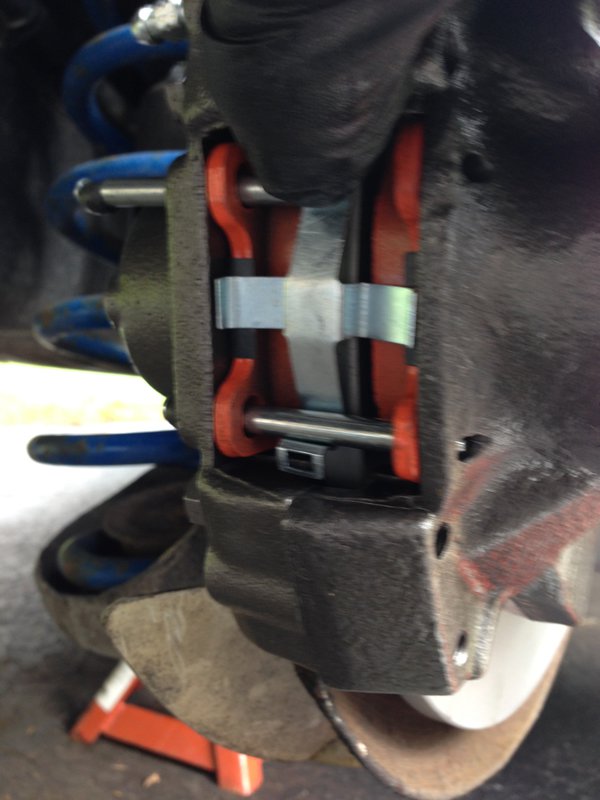 Place spring in place, load lower pin, then push spring with finger and load upper pin