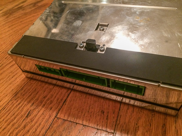 close up of button on base of ECC