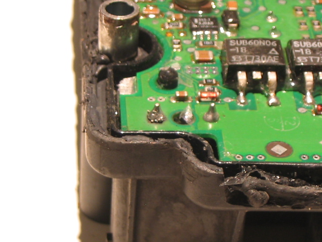 Notice how the bottom left motor pin looks different that the right one. Also, note it's a bit blackened underneath. This is where it had separated from the PC board. The solder also appears "gritty". Don't remember leaving it like that.