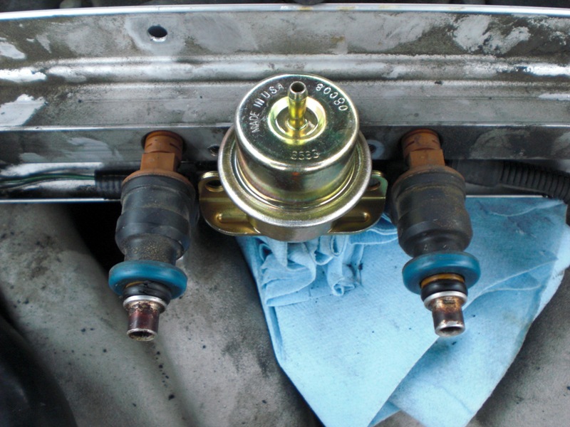 f.p.r. in fuel rail. This was a little tricky b/c I wasn't sure if I had it in far enough. I just kept pushing straight (don't wiggle side to side) and it "popped in."