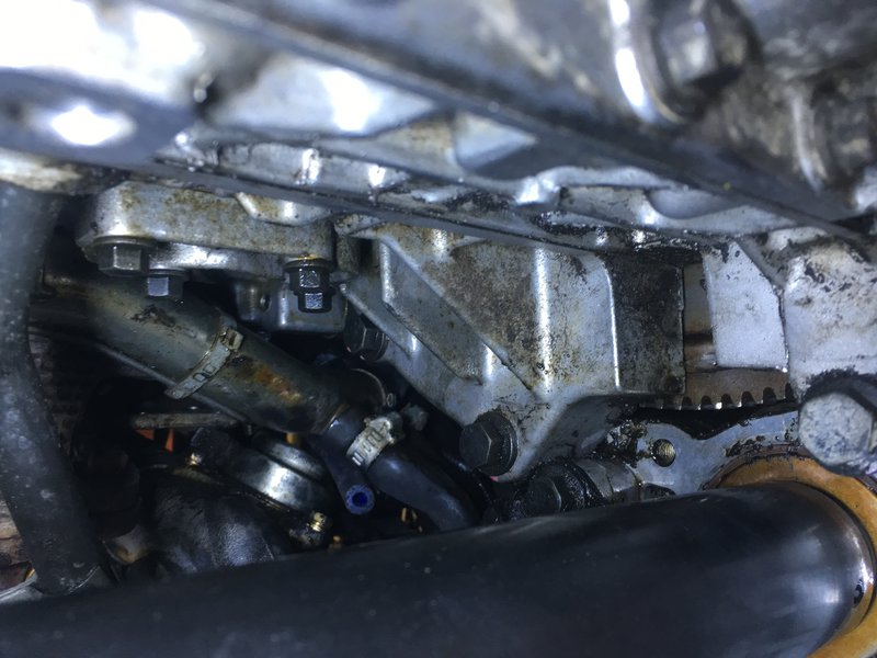 Looking above driver side drove axle seal at oil below turbo.