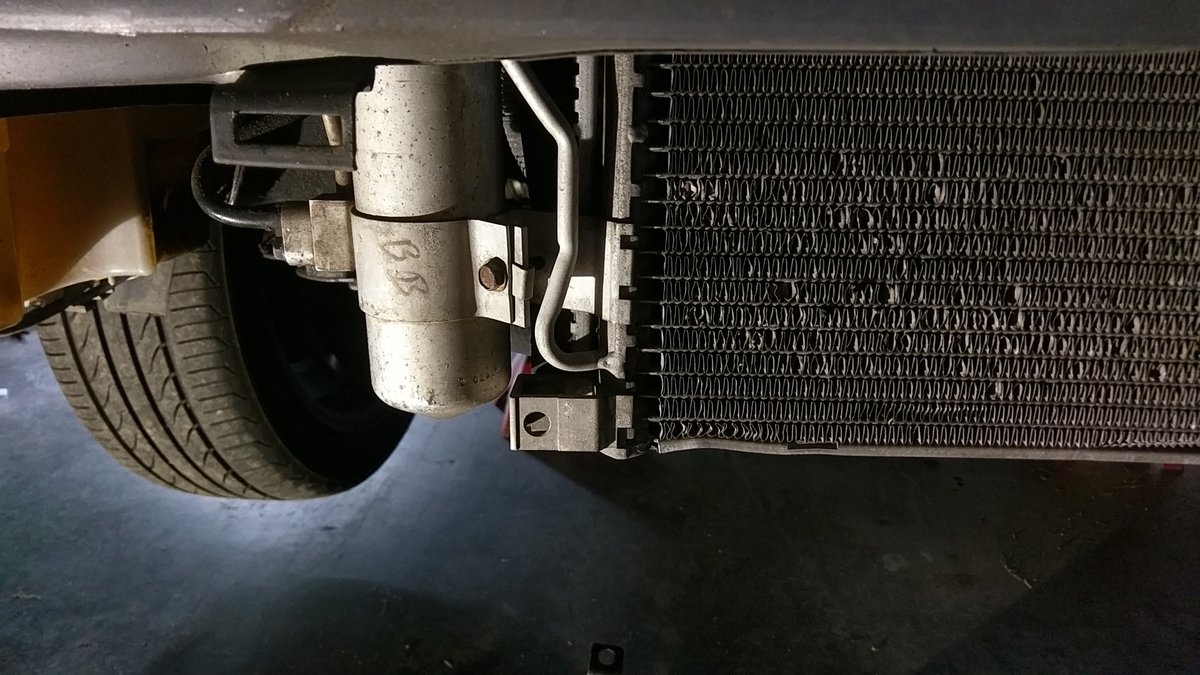 Passenger side mounting tab