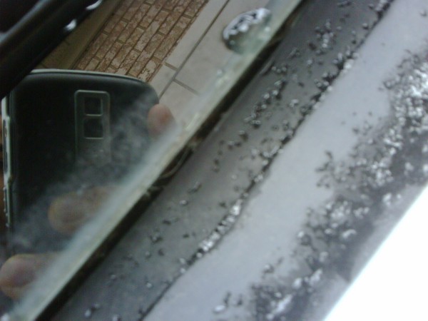 In this photo you can clearly see the base of the windshield glass completely exposed...hmm