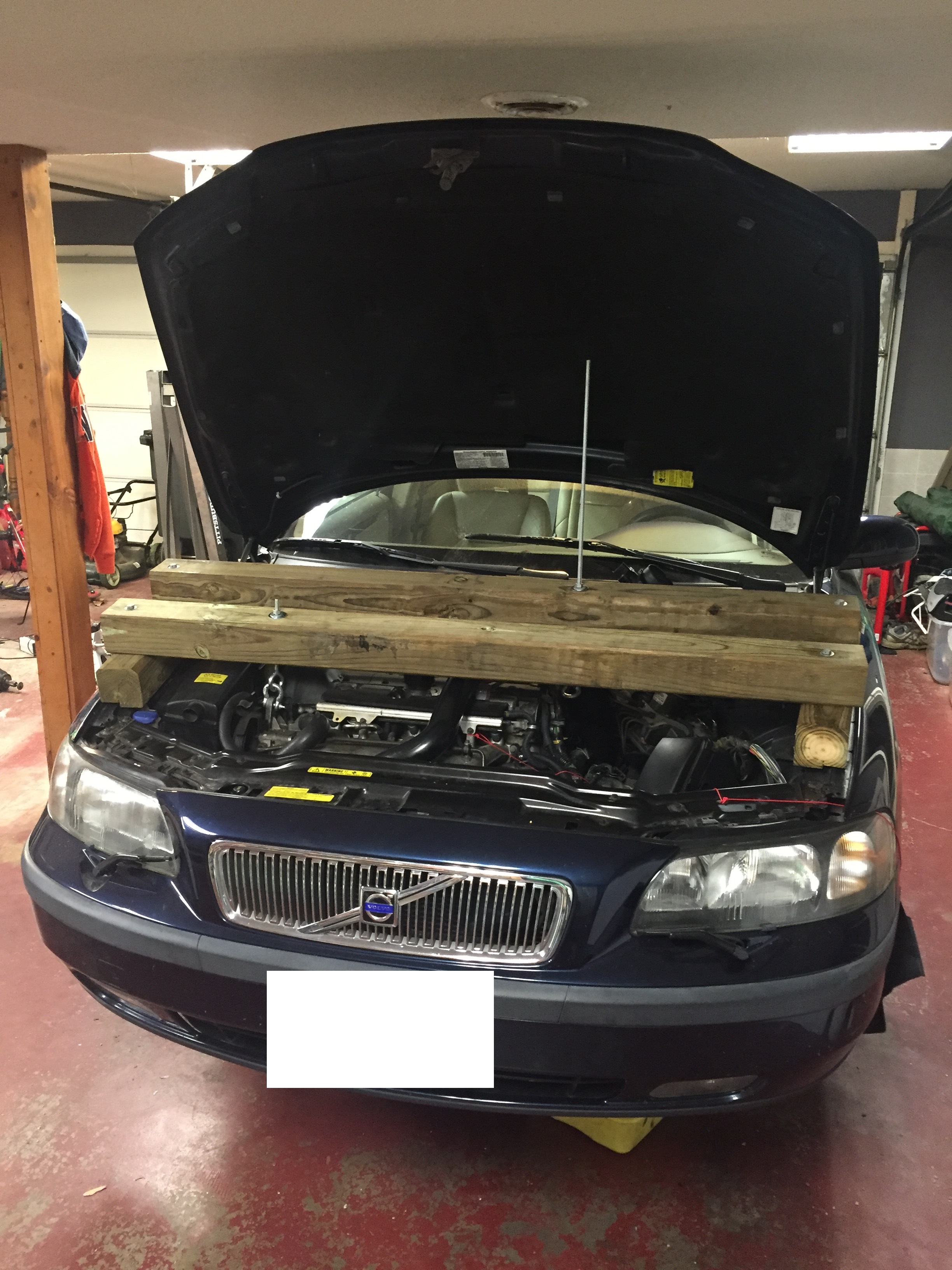 Bridging device built for this, allows the front of engine to come up and the rear to be dropped