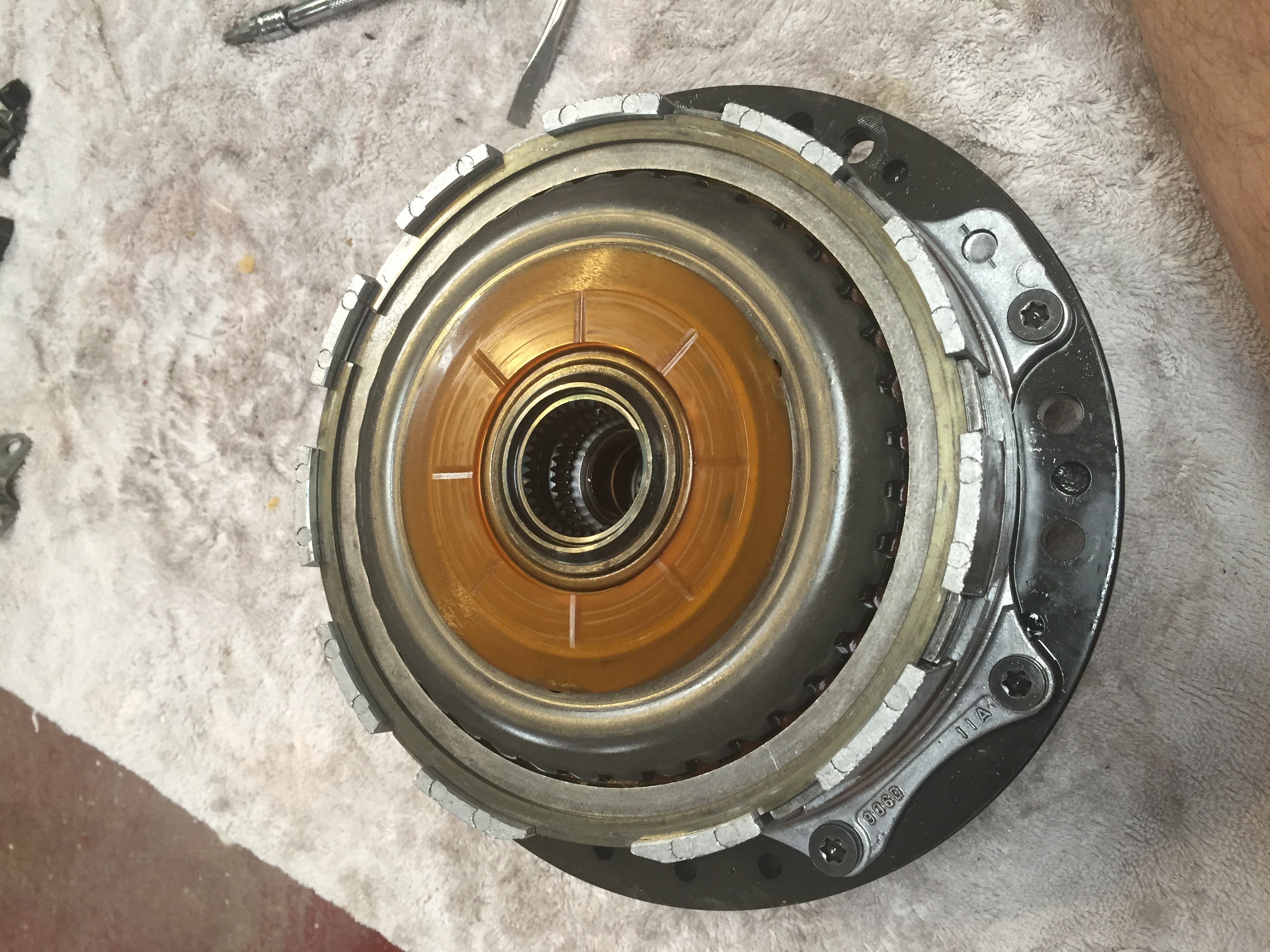 Pump assembly with 1-2 clutch pack all assembled on rear