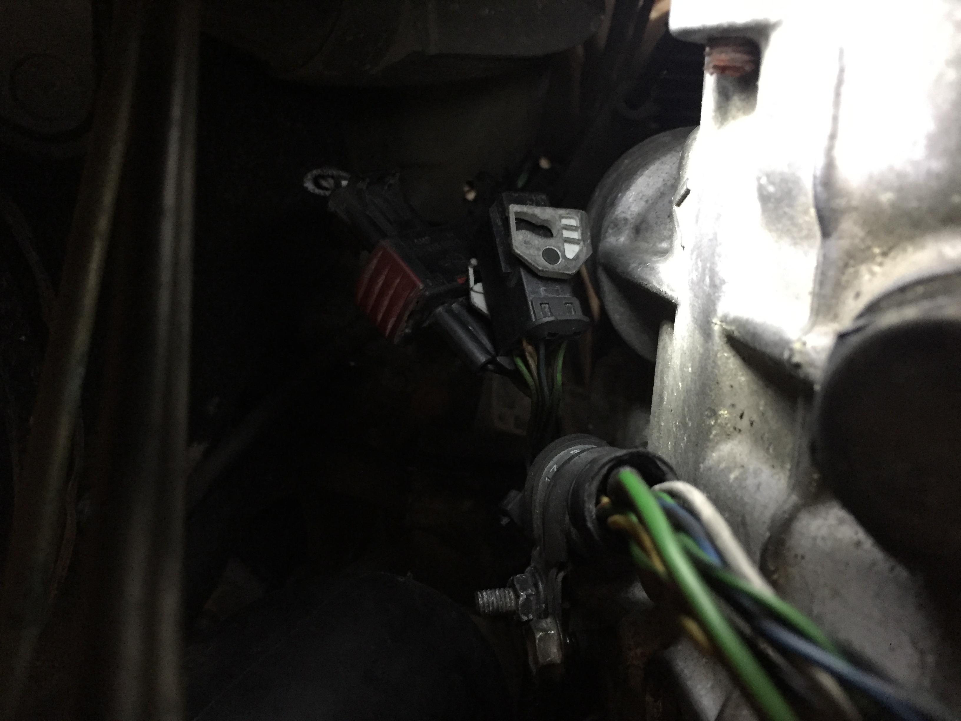 Disconnect cables at rear of trans