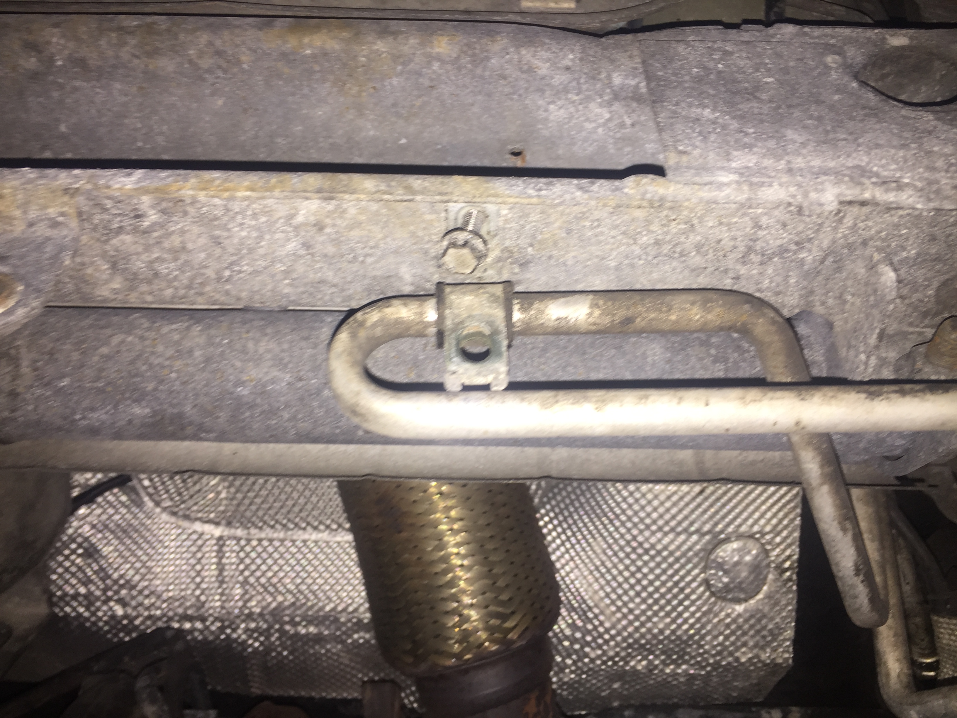 Step 18 Remove rear oil line clamp