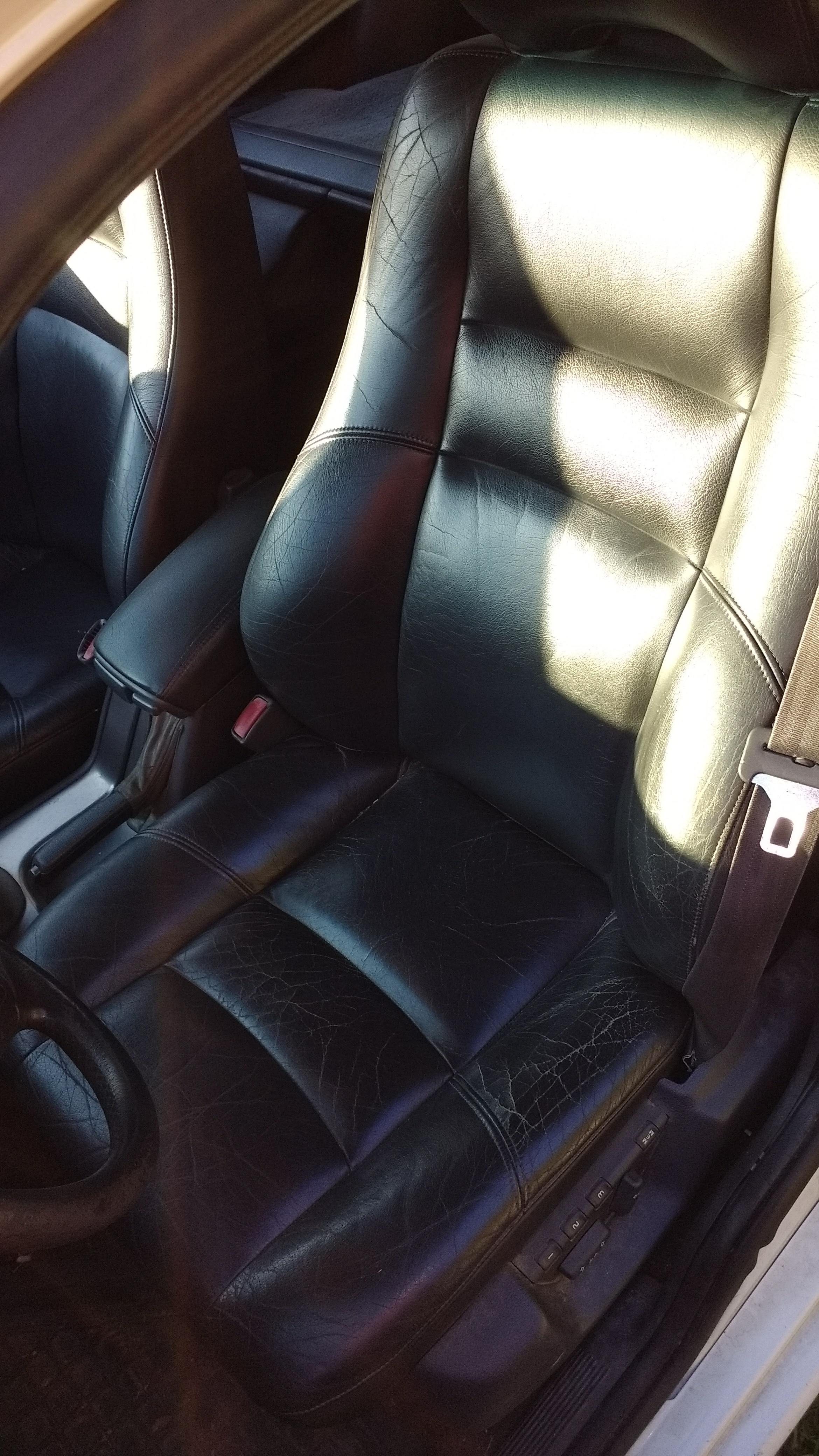 Driver's seat. Cracking all around.