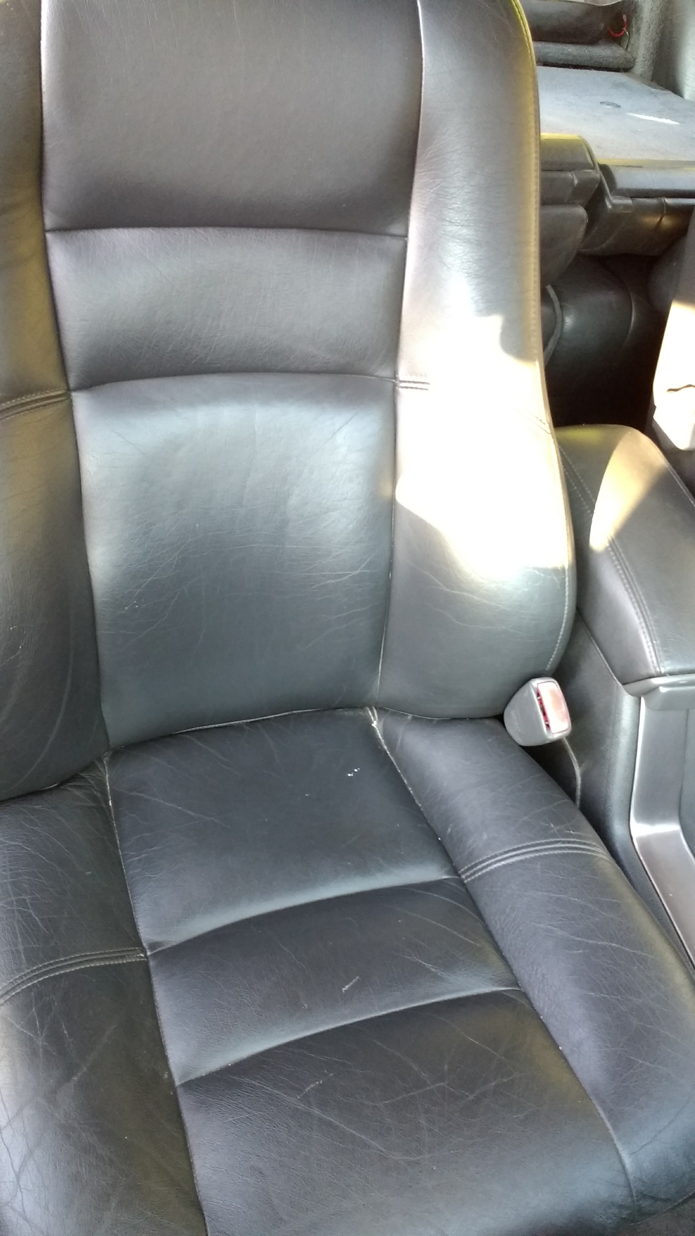 Passenger's seat. Not bad, but cracked.