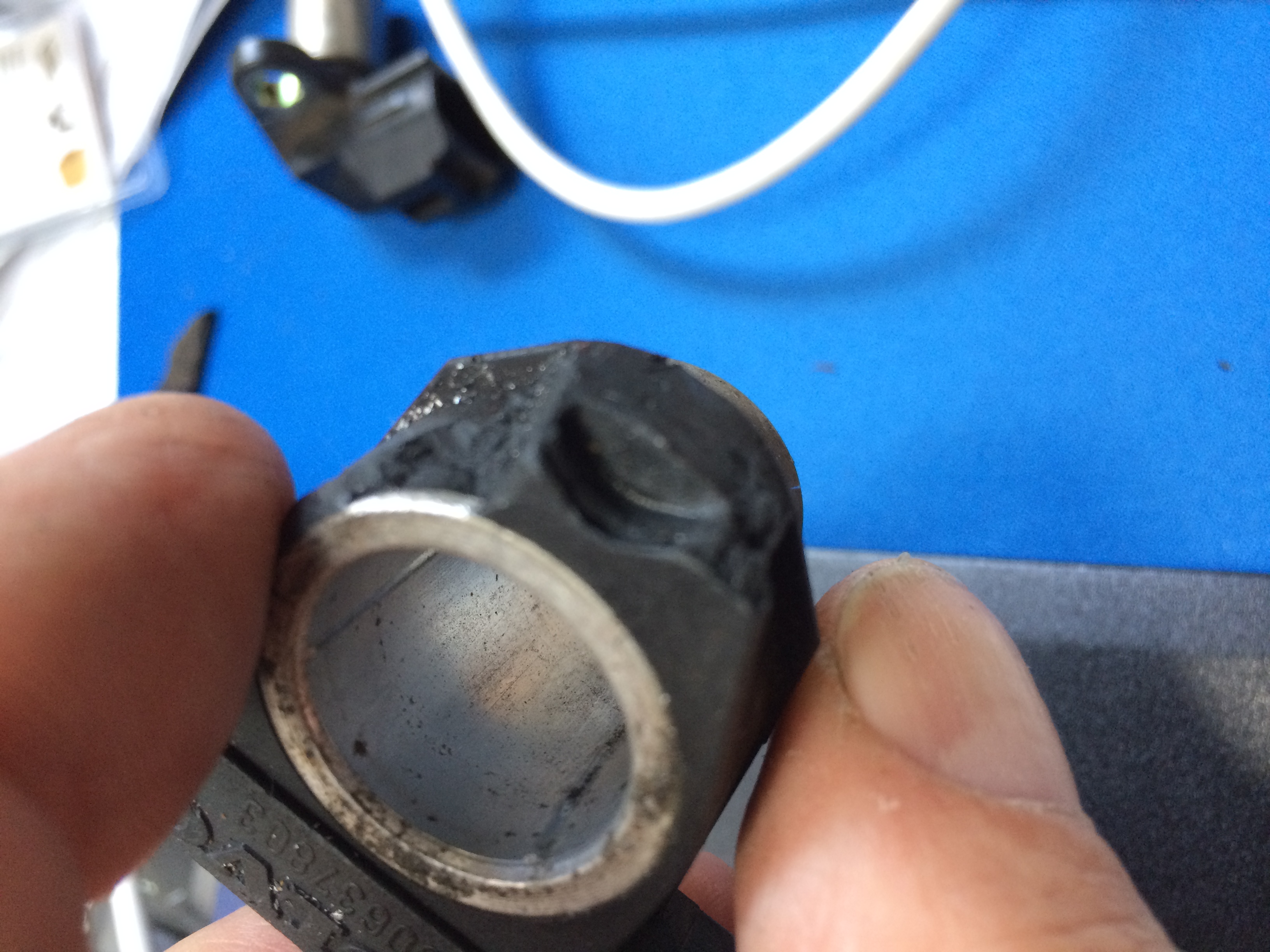 Note filed Bakelite that used to hold the 10mm hold down bolt