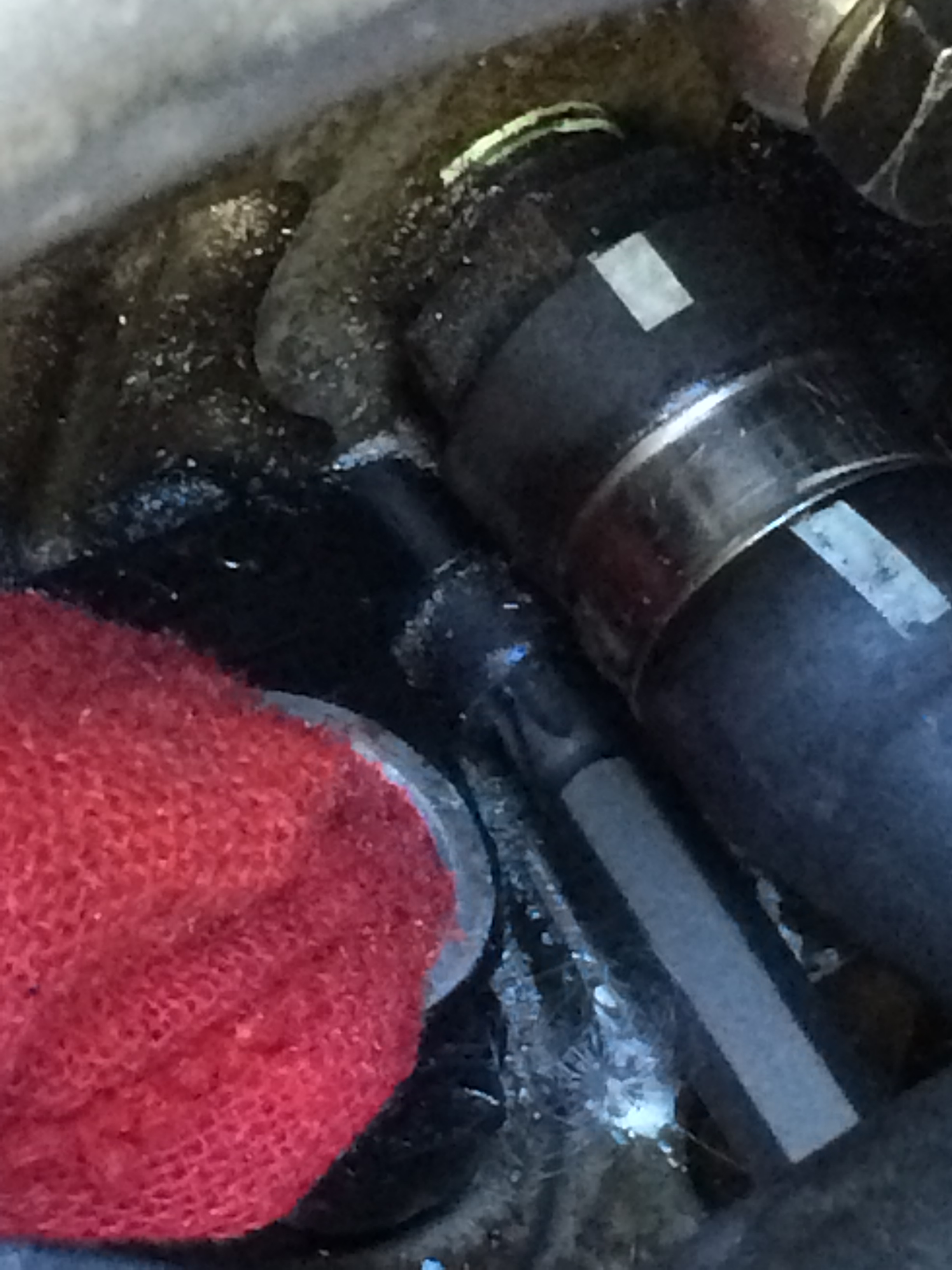 T40 Torx wrench fitted to aft side bolt on mounting bracket