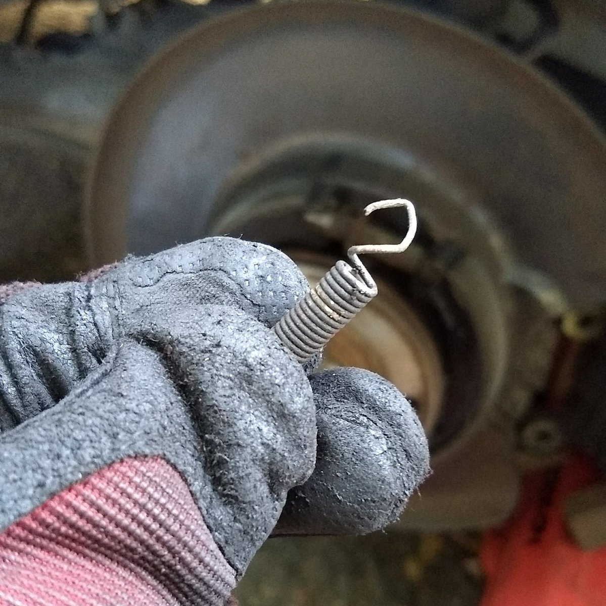 The old, broken spring that I previously reshaped.