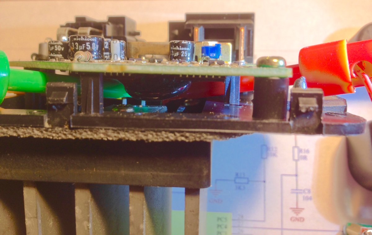Clips attached to the G, S and D of the transistor -- side view