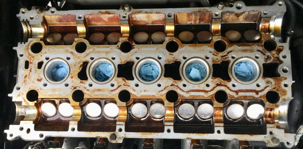 AFTER: Top side of cylinder head without camshafts, after the first round of cleaning.