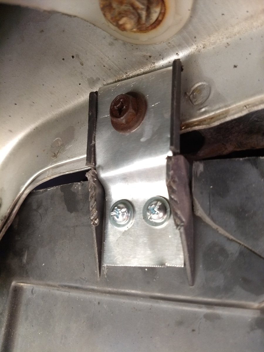 Repaired tabs on a V70 air guide, right side.